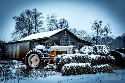 Snow covering a farm field and fence line in South Carolina