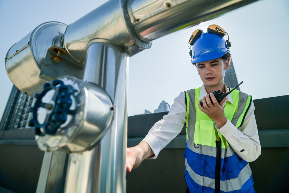 Engineer,In,Safety,Gear,Conducts,Inspection,On,Large,Industrial,Water